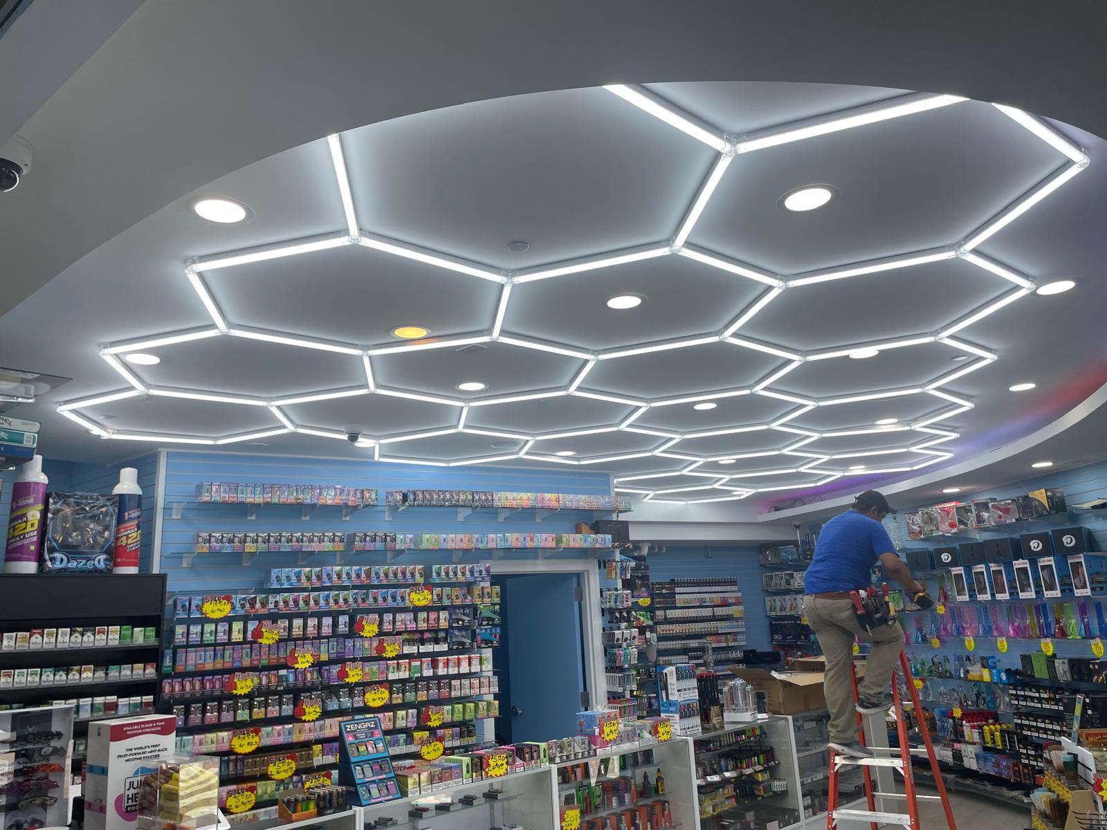 Hexagon LED honeycomb ceiling lighting installed by JAC Electrical in a retail store