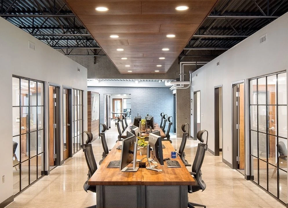 Open office with wood ceiling and recessed lighting